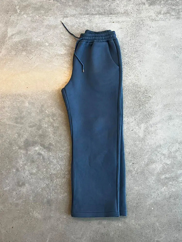 Herr löst sittande träningsoverall