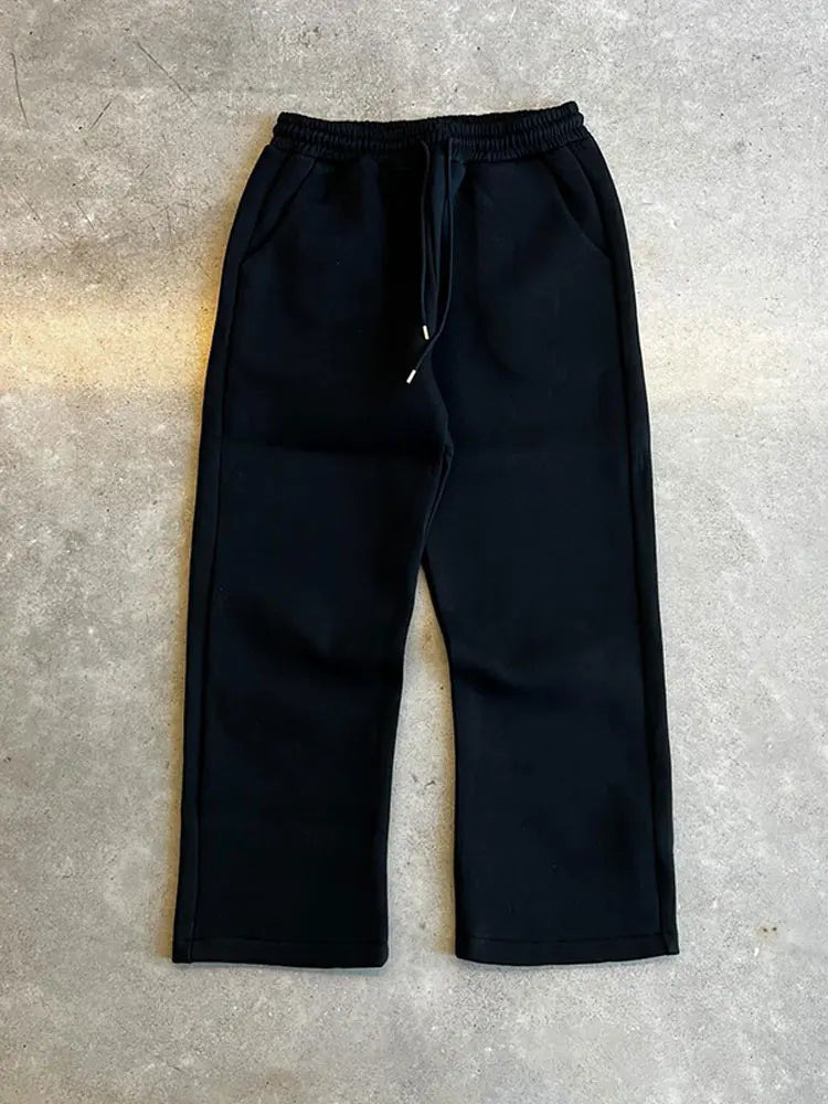 Herr löst sittande träningsoverall